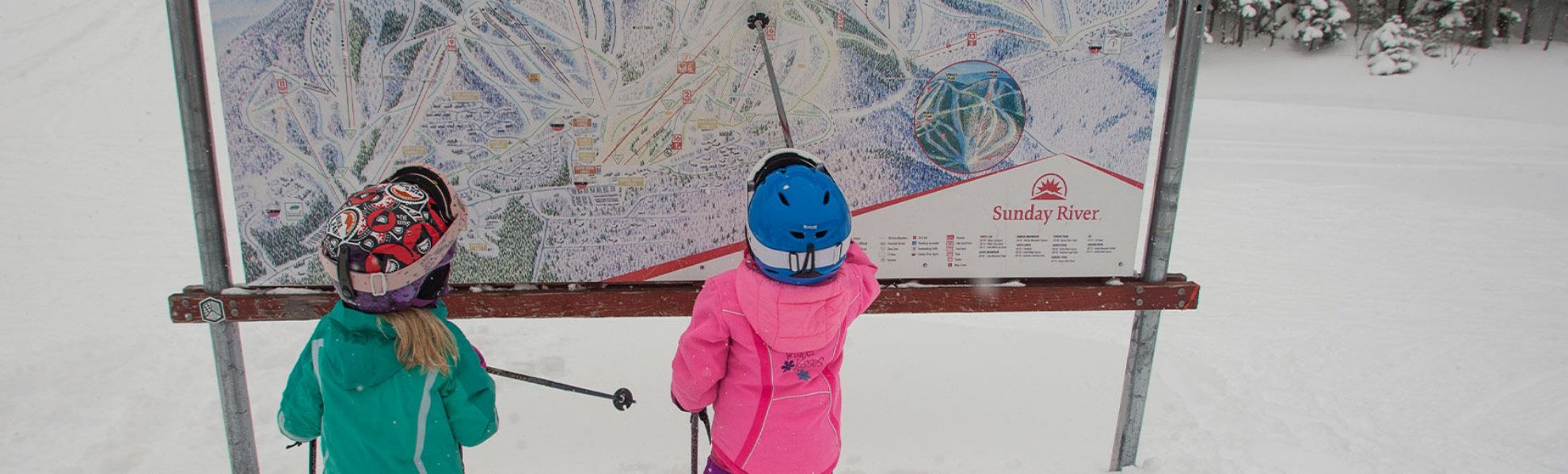 Kids looking at a Ski trail map